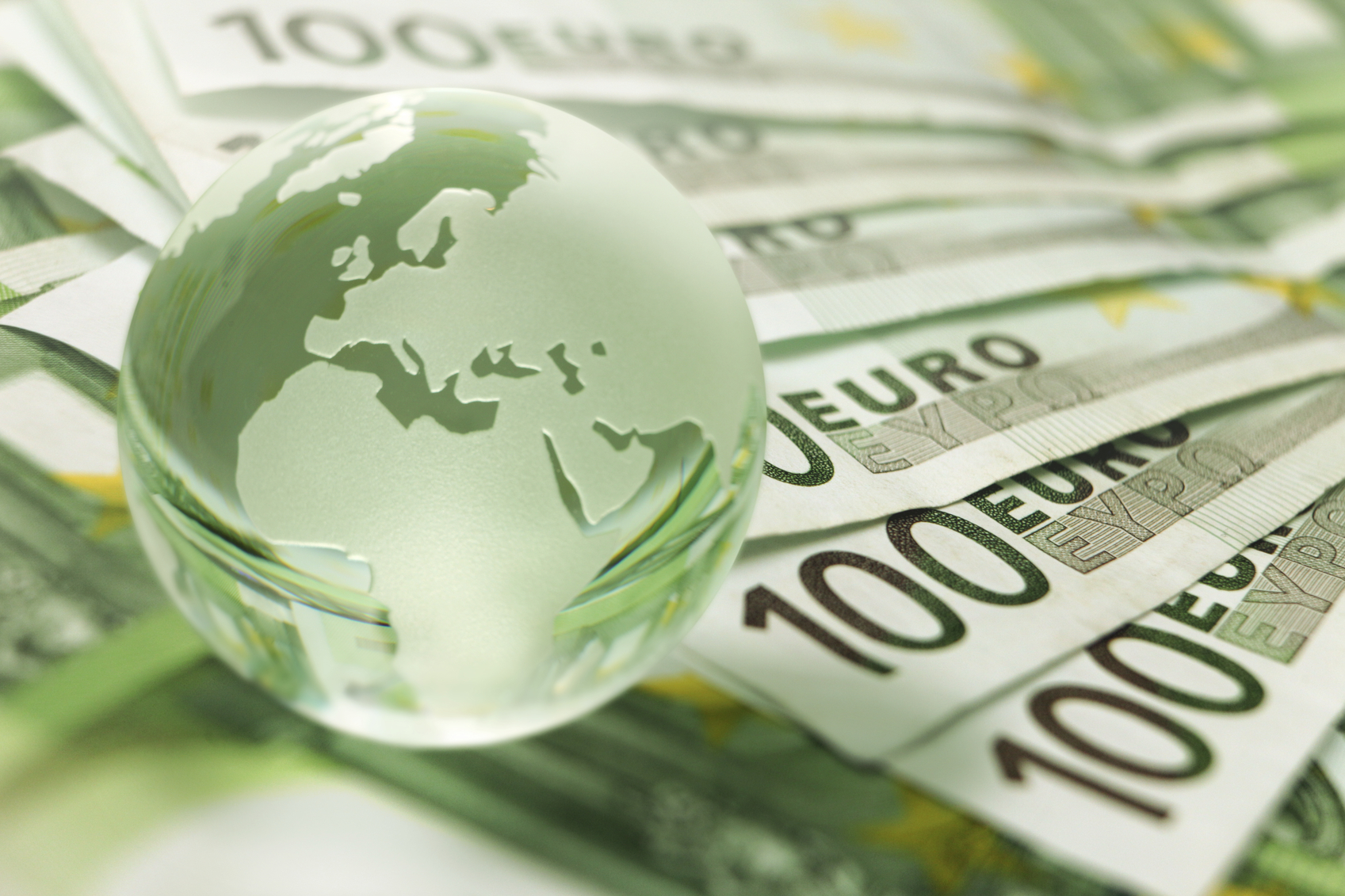 World finance with a close-up of Earth globe on banknotes